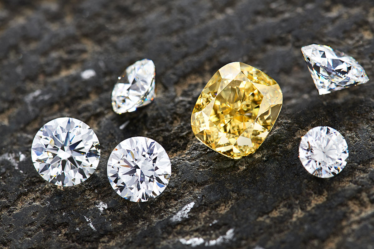 5 different round cut diamonds and 1 large rectangular cushion yellow diamond