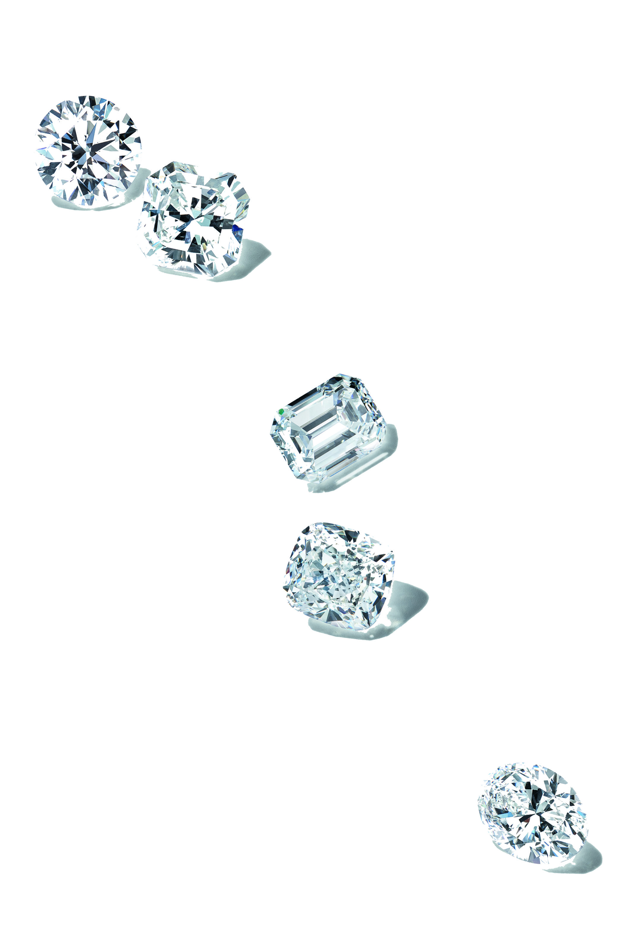 Tiffany loose diamonds after they were sorted, polished and cut. Features a round cut diamond, cushion cut diamond, emerald cut diamond, radiant cut diamond and oval diamond