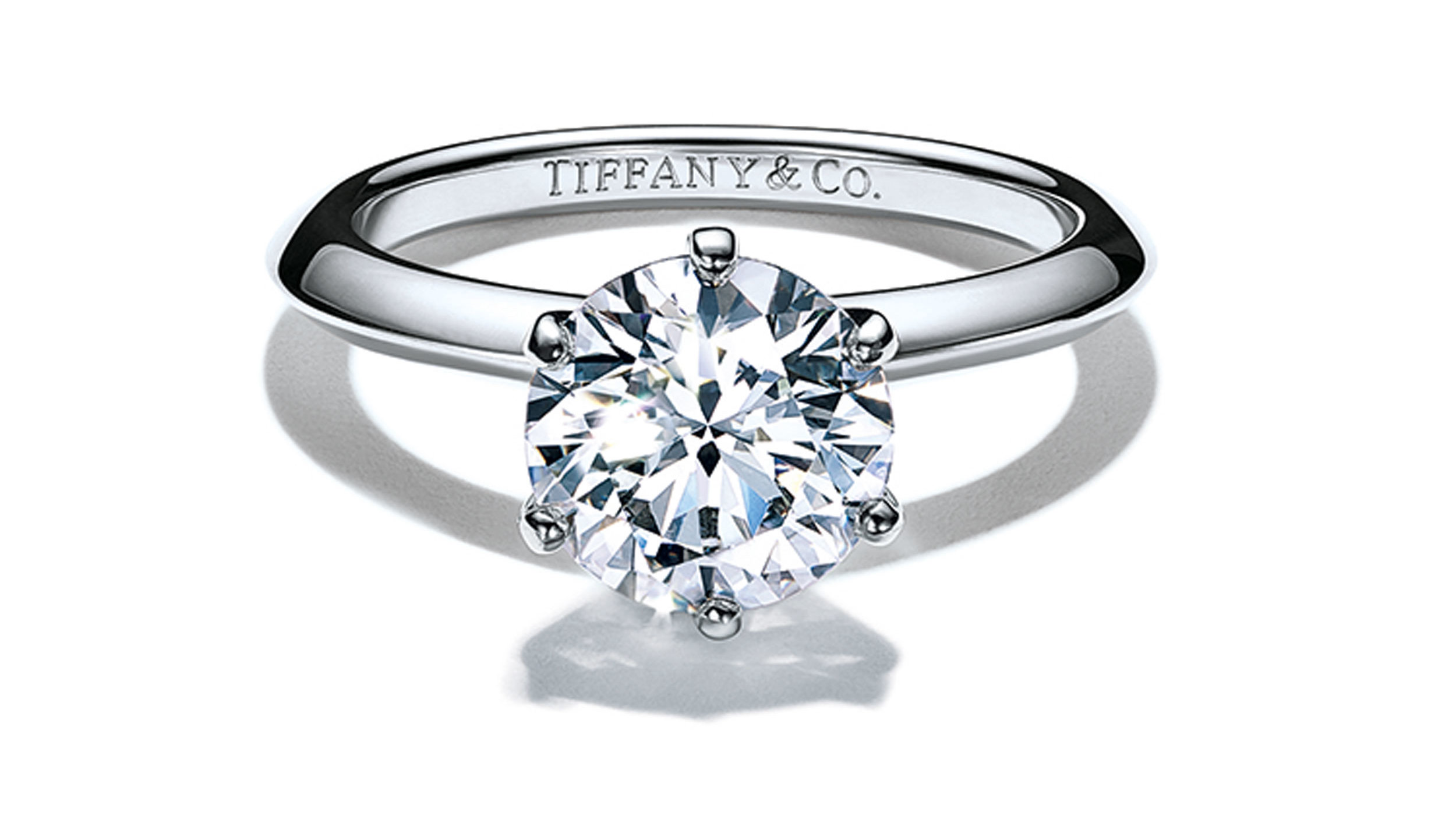 The Tiffany setting engagement ring on a platinum band featuring an ethically sourced round cut diamond engraved with Tiffany & Co. inside