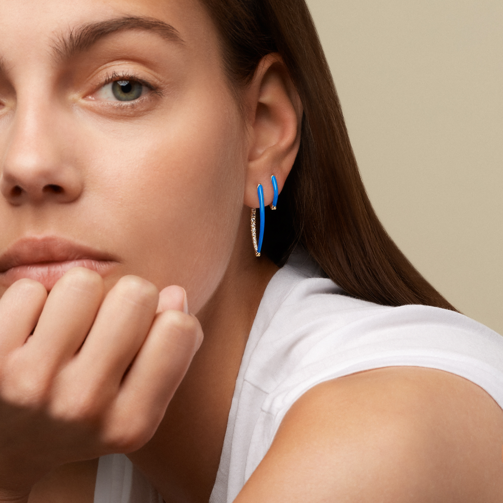 Cristina neon blue enamel hoop earrings with diamonds and a hinged hoop design set in 18k yellow gold from Melissa Kaye