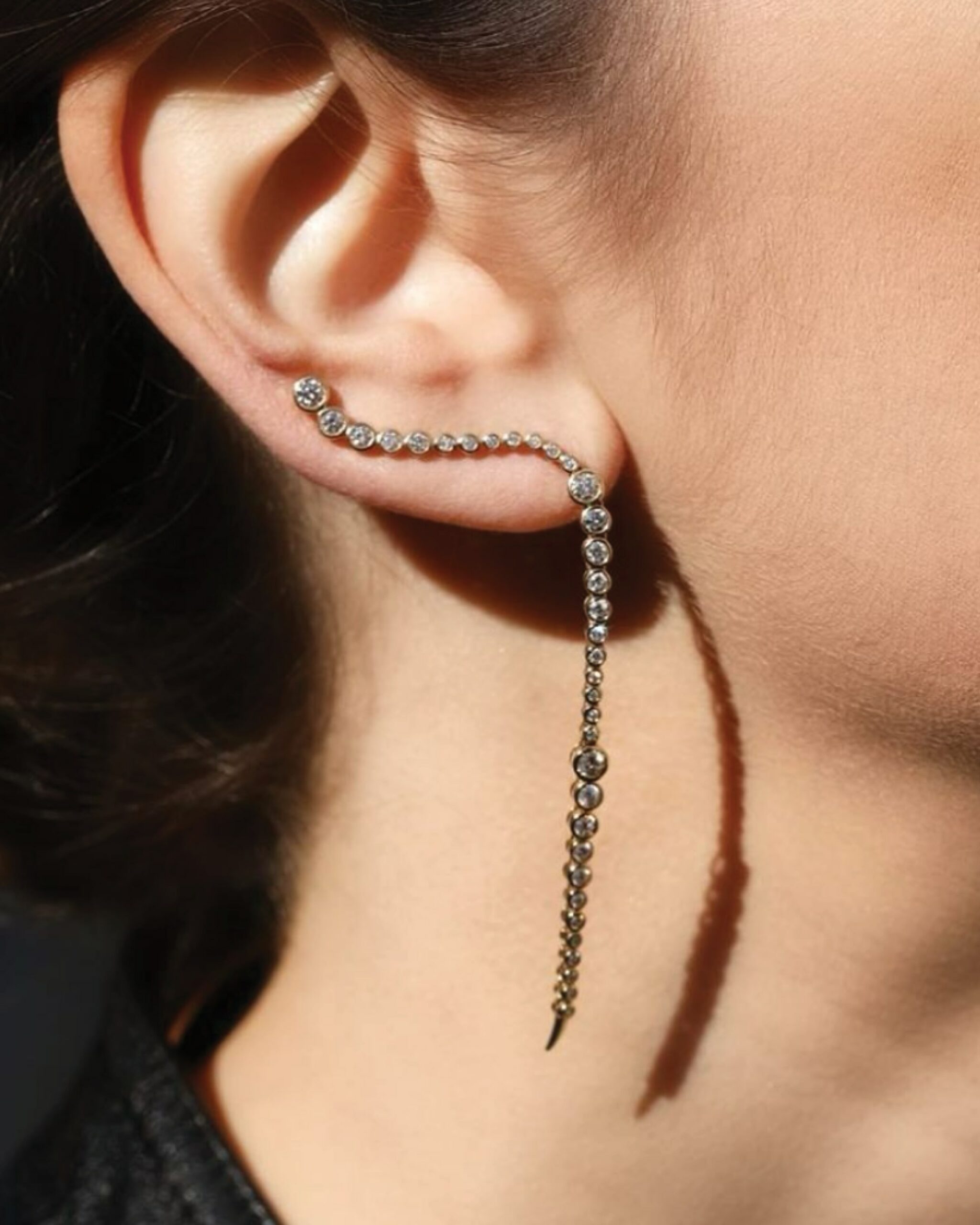 Eminence Diamond Climber Earrings from Ondyn Fine Jewelry that feature bezel set diamonds cascading up and down the ear