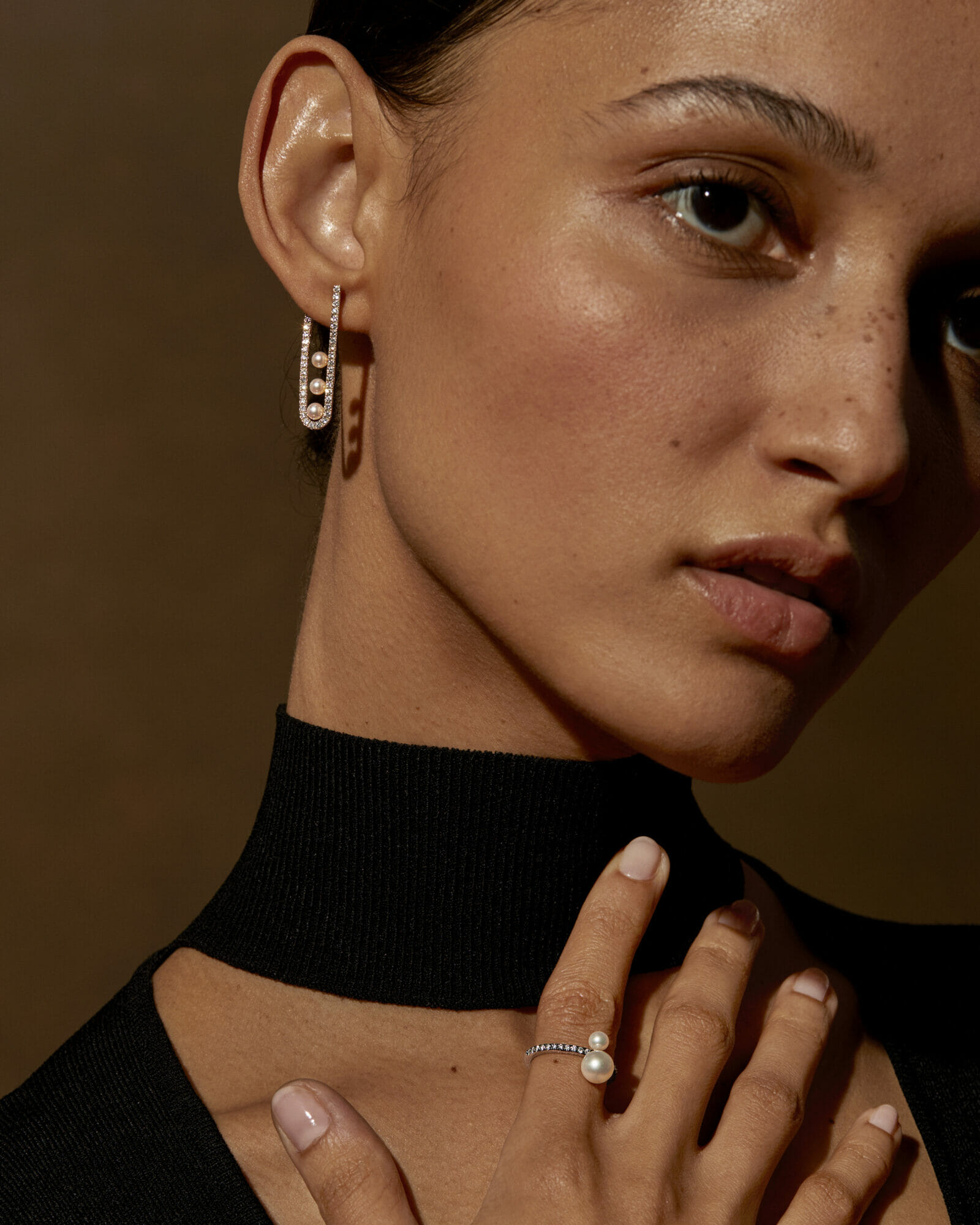 Diamonds and pearls, woman wearing earring and ring