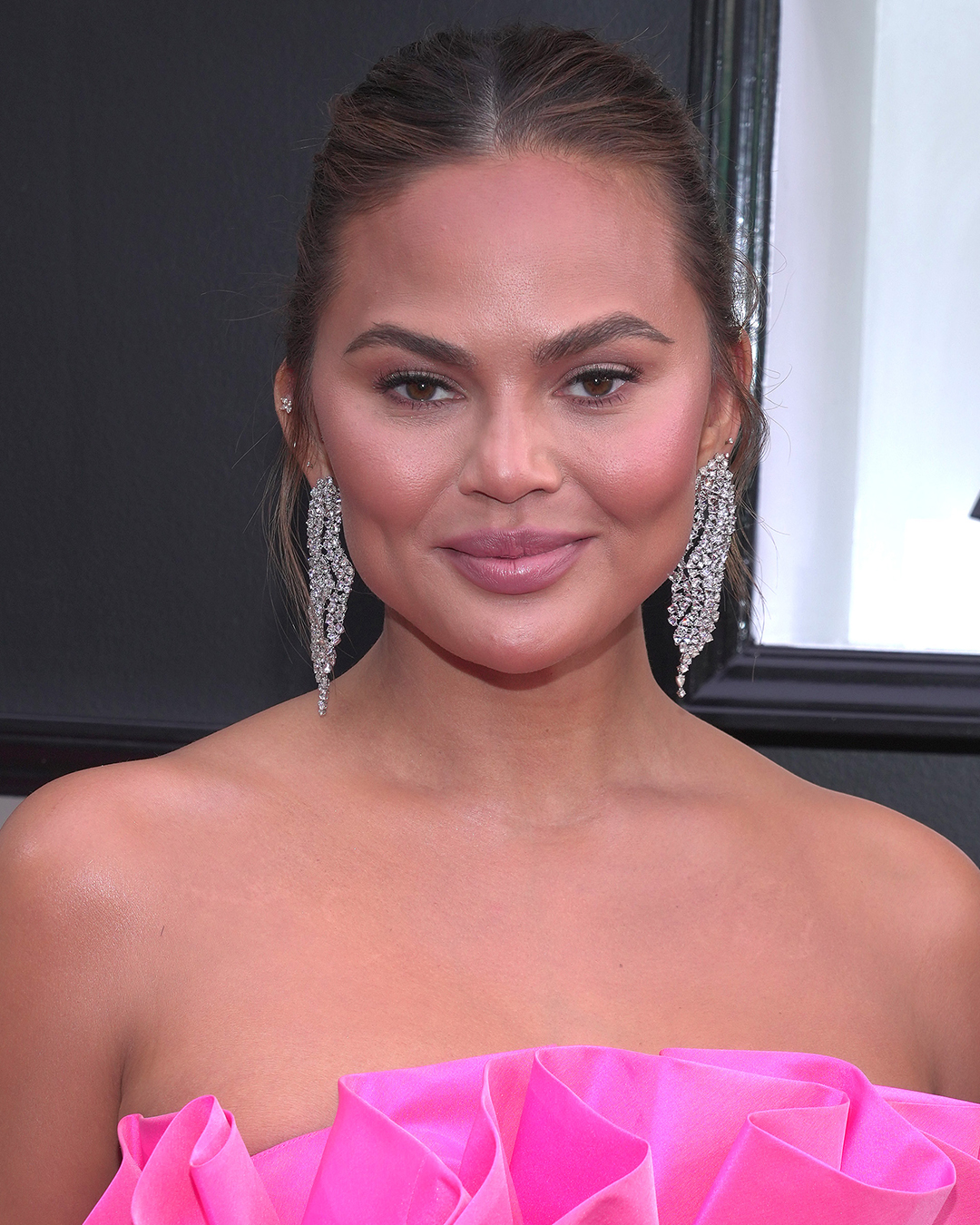 chrissy teigen grammys 2022 diamond jewelry 