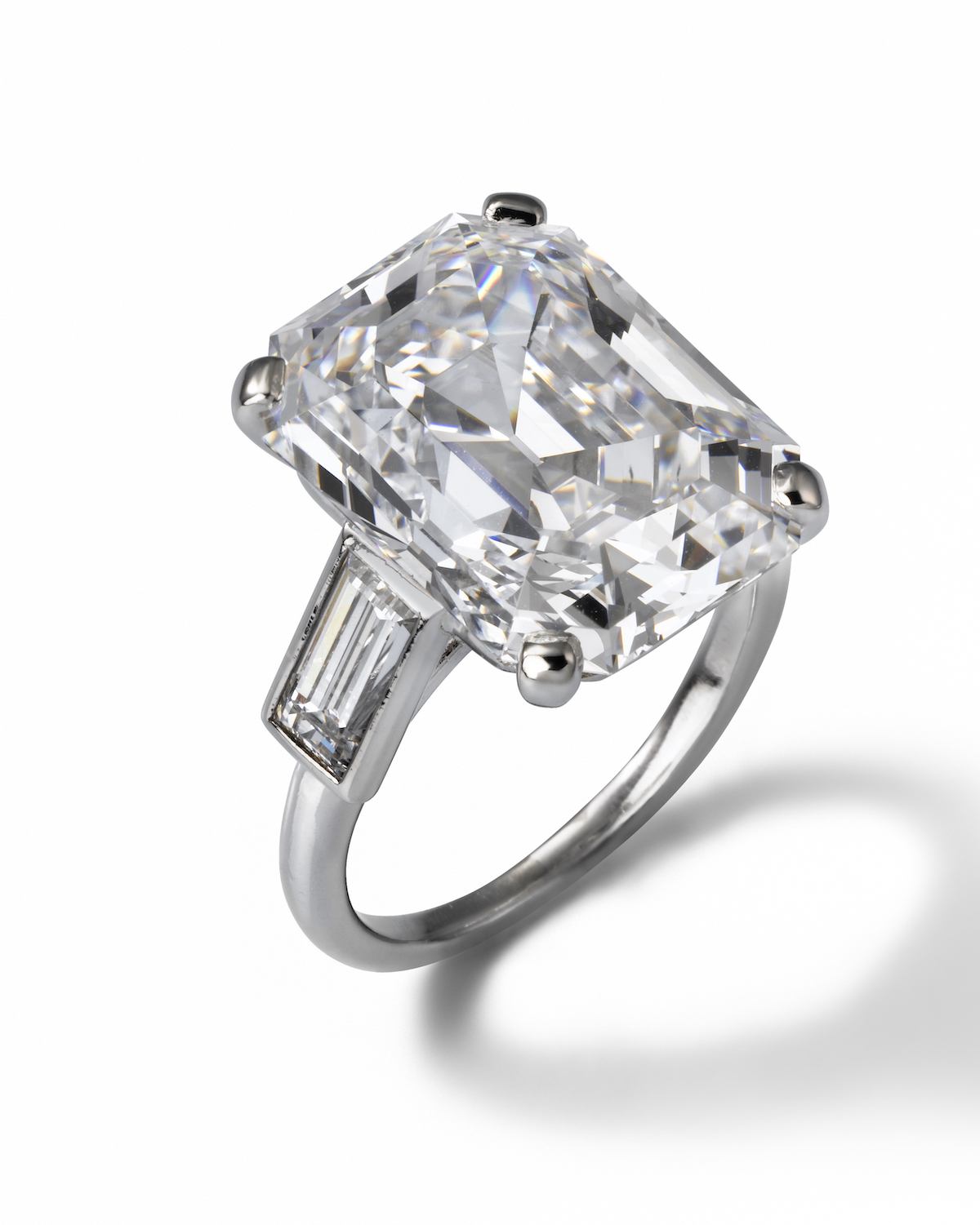  Emerald cut diamond and platinum engagement ring 