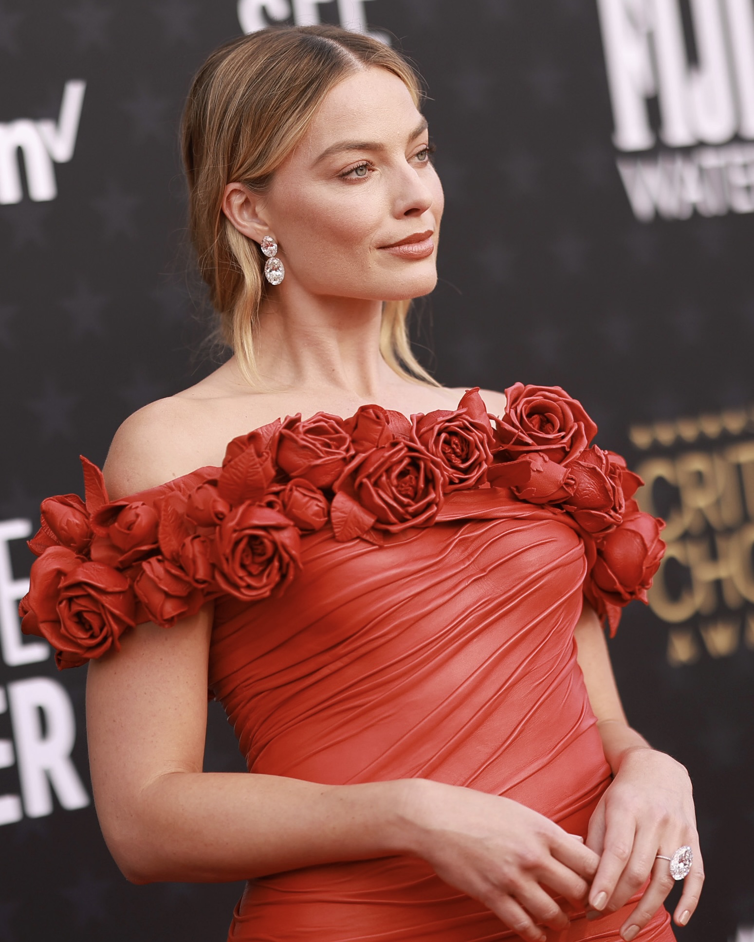 Margot Robbie attends 2024 Critics Choice Awards in Lorraine Schwartz diamonds.