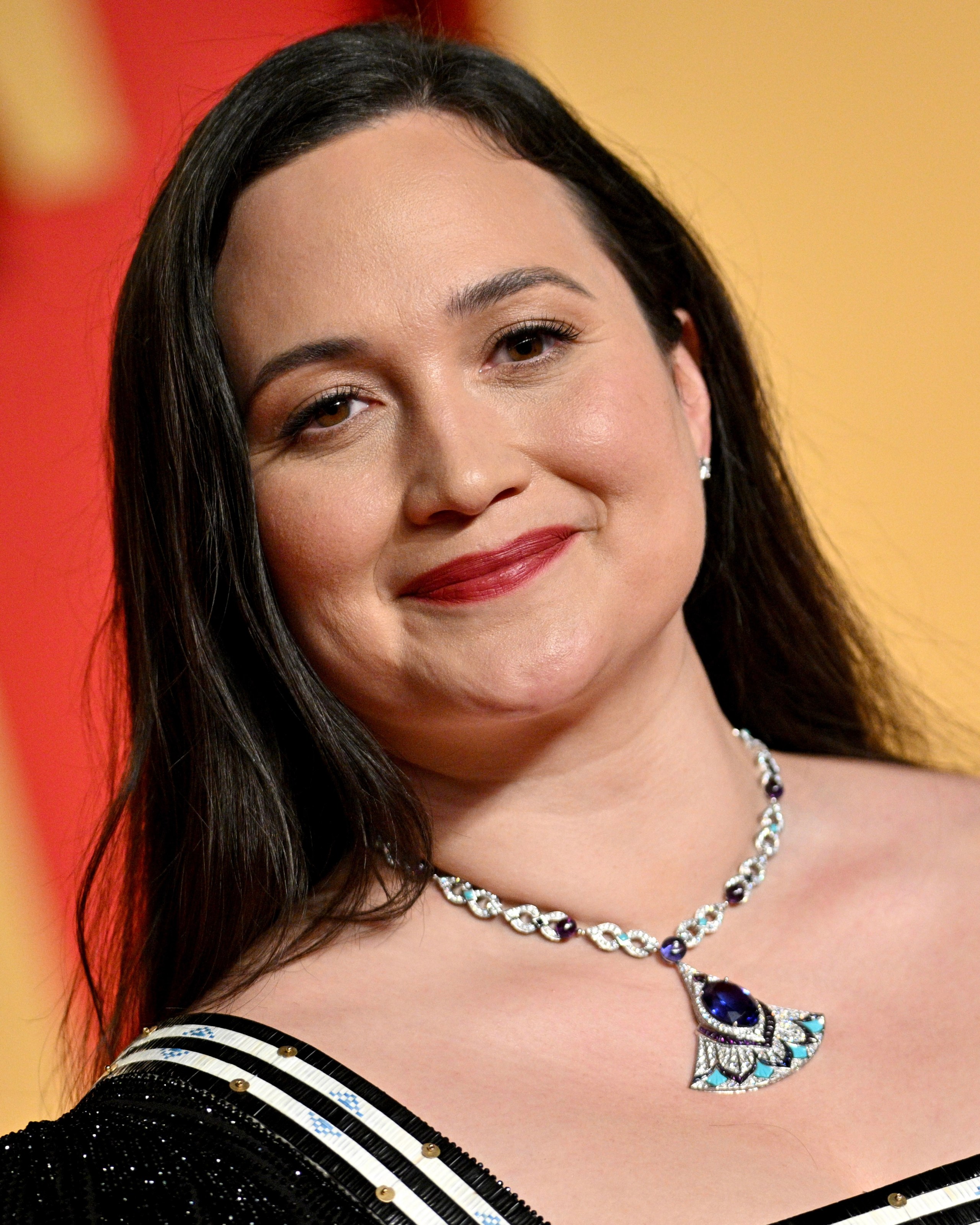 'Killers of the Flower Moon' actress Lily Gladstone attends the 2024 Vanity Fair Oscar Party, wearing exquisite natural diamond jewelry from Bulgari on the red carpet.