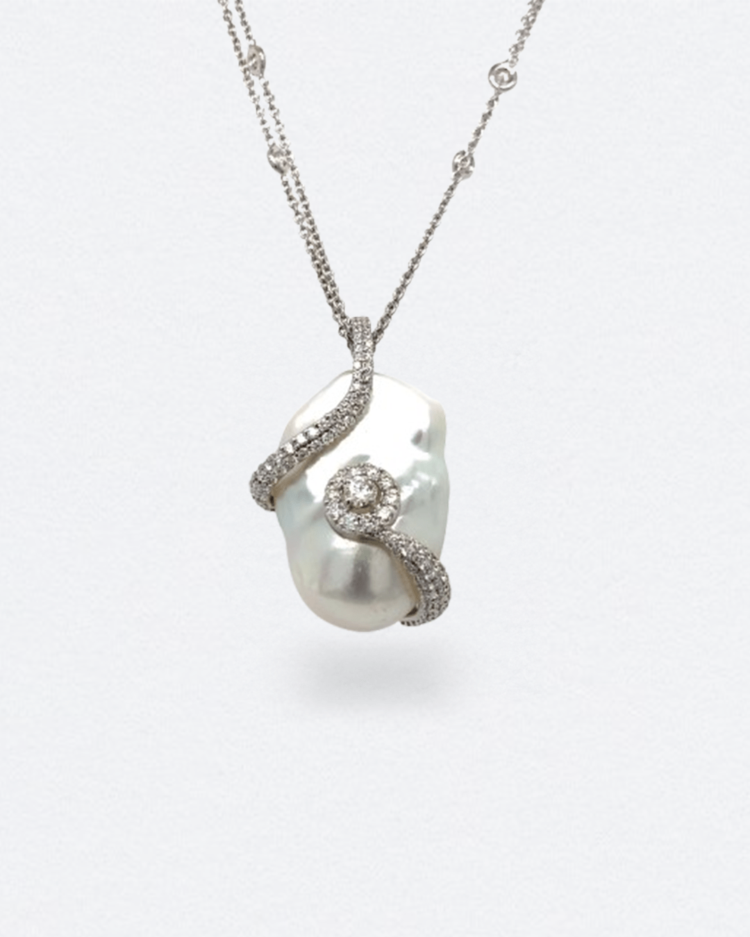 18K white gold necklace with a baroque pearl and natural diamond