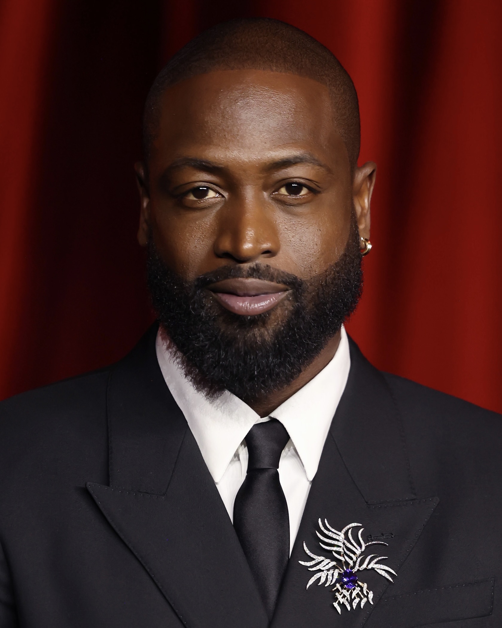 Dwyane Wade attends the 2024 Academy Museum Gala in Tiffany & Co. diamond jewelry.